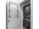 Convenient laundry room featuring a stacked washer and dryer at 635 Broadview Ne Pl, Atlanta, GA 30324