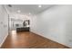 Open-concept living room featuring wood floors and a kitchen with a breakfast bar at 635 Broadview Ne Pl, Atlanta, GA 30324