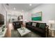 Open living space with modern decor, hardwood floors, and a view into the kitchen at 635 Broadview Ne Pl, Atlanta, GA 30324