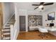 Bright office space featuring hardwood floors, modern furniture, and a functional built-in bookshelf for organization at 635 Broadview Ne Pl, Atlanta, GA 30324