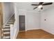 Home office with wood floors, staircase, and painted plank accent wall at 635 Broadview Ne Pl, Atlanta, GA 30324
