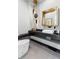 Modern bathroom with unique vanity, modern lighting, and sleek fixtures at 8610 Sentinae Chase Dr, Roswell, GA 30076
