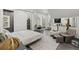 Large bedroom featuring natural light, walk-in closet, and sitting area at 8610 Sentinae Chase Dr, Roswell, GA 30076