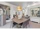 An open dining area with contemporary art and sliding door access to a screened in porch at 8610 Sentinae Chase Dr, Roswell, GA 30076