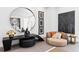 Cozy sitting area featuring unique artwork, a round mirror, and comfortable seating at 8610 Sentinae Chase Dr, Roswell, GA 30076