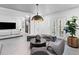 Bright living room boasts modern design, striking decor, and neutral color palette at 8610 Sentinae Chase Dr, Roswell, GA 30076
