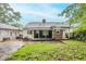 Exterior view of the home highlighting the backyard and screened in porch at 1615 Stokes Sw Ave, Atlanta, GA 30310