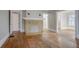 A living room with hardwood floors and a brick fireplace at 1615 Stokes Sw Ave, Atlanta, GA 30310