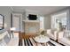A staged living room with a fireplace and a tv at 1615 Stokes Sw Ave, Atlanta, GA 30310