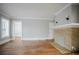 Living room featuring a fireplace, hardwood floors, and neutral paint color at 1615 Stokes Sw Ave, Atlanta, GA 30310
