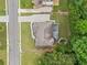 Aerial view of the home with a long driveway, and a well-manicured lawn at 1898 Alcovy Shoals Se Blf, Lawrenceville, GA 30045