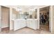 Bright bathroom features double sinks, a large mirror, and access to a walk-in closet at 1898 Alcovy Shoals Se Blf, Lawrenceville, GA 30045