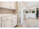 Bright bathroom with double vanities, a door to the closet, and plenty of storage at 1898 Alcovy Shoals Se Blf, Lawrenceville, GA 30045