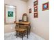 Well-lit bathroom vanity area with wicker furniture and stylish wall art at 1898 Alcovy Shoals Se Blf, Lawrenceville, GA 30045