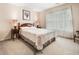 Comfortable bedroom with soft carpet, natural light, and soothing neutral color scheme at 1898 Alcovy Shoals Se Blf, Lawrenceville, GA 30045