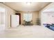 Spacious bonus room with a dining table, refrigerator, and exercise area at 1898 Alcovy Shoals Se Blf, Lawrenceville, GA 30045