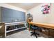 Bright craft room featuring ample workspace, storage shelves, and creative décor at 1898 Alcovy Shoals Se Blf, Lawrenceville, GA 30045