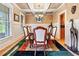 Elegant dining room with a coffered ceiling and hardwood floors at 1898 Alcovy Shoals Se Blf, Lawrenceville, GA 30045