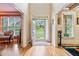 Bright foyer with hardwood floors and views into adjacent living spaces at 1898 Alcovy Shoals Se Blf, Lawrenceville, GA 30045
