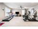 Home gym equipped with a treadmill, elliptical machine, and weightlifting equipment at 1898 Alcovy Shoals Se Blf, Lawrenceville, GA 30045
