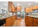 Gourmet kitchen with stainless steel appliances, granite countertops, and custom cabinetry at 1898 Alcovy Shoals Se Blf, Lawrenceville, GA 30045