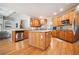 Spacious kitchen boasts custom wood cabinetry, granite countertops, and stainless steel appliances at 1898 Alcovy Shoals Se Blf, Lawrenceville, GA 30045