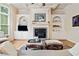 Inviting living room with a fireplace, custom built-ins, and natural light at 1898 Alcovy Shoals Se Blf, Lawrenceville, GA 30045