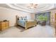 Relaxing bedroom with trey ceilings, sitting area, and abundant natural light at 1898 Alcovy Shoals Se Blf, Lawrenceville, GA 30045