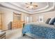 A serene main bedroom boasts a trey ceiling, a large window, and a charming dresser with mirror at 1898 Alcovy Shoals Se Blf, Lawrenceville, GA 30045