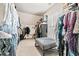 Spacious walk-in closet with ample storage space and well-organized shelving at 1898 Alcovy Shoals Se Blf, Lawrenceville, GA 30045