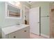 Bathroom with a white vanity, neutral tile flooring, and access to the shower area at 2395 Holly Branch Dr, Cumming, GA 30040