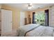 Comfortable bedroom with neutral carpet, a ceiling fan, and a window with natural light at 2395 Holly Branch Dr, Cumming, GA 30040