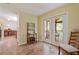 Dining area with a wine rack, a view of the porch through glass doors, and seating for six at 2395 Holly Branch Dr, Cumming, GA 30040
