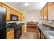 Well-equipped kitchen featuring modern appliances and a view into the adjacent dining area at 2395 Holly Branch Dr, Cumming, GA 30040