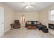 Cozy living room with plush carpet, a modern couch, chair and a view to an adjacent room at 2395 Holly Branch Dr, Cumming, GA 30040