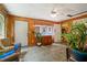 Charming sun room with wood paneling, ceramic tile floor, and a view to the surrounding yard at 2395 Holly Branch Dr, Cumming, GA 30040