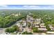 Aerial view of the neighborhood showcasing a local street, neighborhood buildings, and verdant trees at 270 Park Bridge Ln, Roswell, GA 30075