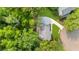 Aerial view of a home showcasing lush green surroundings and a long driveway leading to the property at 270 Park Bridge Ln, Roswell, GA 30075