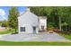 Rear exterior of the home featuring a stone patio, private entrance, and a well-maintained lawn at 270 Park Bridge Ln, Roswell, GA 30075