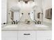 Modern bathroom features double sinks with granite counters, oval mirrors, and bronze fixtures at 270 Park Bridge Ln, Roswell, GA 30075
