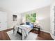 Bright bedroom offers hardwood floors, lots of natural light, and a peaceful atmosphere at 270 Park Bridge Ln, Roswell, GA 30075