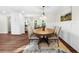 Bright dining room with hardwood floors that opens up to the living room at 270 Park Bridge Ln, Roswell, GA 30075
