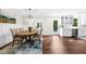 Bright dining room featuring hardwood floors and an adjacent kitchen at 270 Park Bridge Ln, Roswell, GA 30075