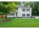 Charming two-story home with black shutters and a well-manicured lawn, showcasing classic curb appeal at 270 Park Bridge Ln, Roswell, GA 30075