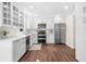 A bright, all-white kitchen with stainless steel appliances and sleek cabinetry at 270 Park Bridge Ln, Roswell, GA 30075