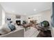 Bright and inviting living room with fireplace, comfortable seating, and an open layout to the dining area at 270 Park Bridge Ln, Roswell, GA 30075