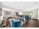 Bright living room boasts hardwood floors, neutral walls, and modern furniture at 270 Park Bridge Ln, Roswell, GA 30075