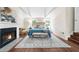 Beautiful primary bedroom featuring neutral decor, a fireplace, and hardwood floors at 270 Park Bridge Ln, Roswell, GA 30075