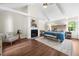 Large main bedroom with fireplace, hardwood floors, lots of light and neutral decor at 270 Park Bridge Ln, Roswell, GA 30075