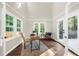 Bright office space with vaulted ceilings, large windows, and neutral decor, ideal for a productive work environment at 270 Park Bridge Ln, Roswell, GA 30075